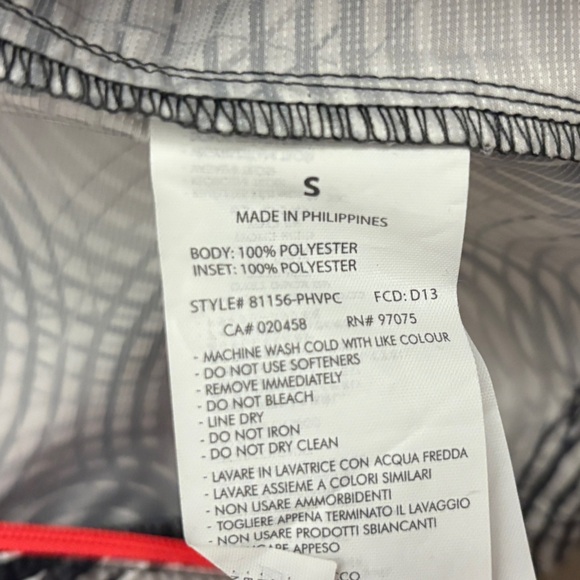 Saucony Black & White Swirl Running Jacket with Vibrant Coral Accents - Picture 12 of 16